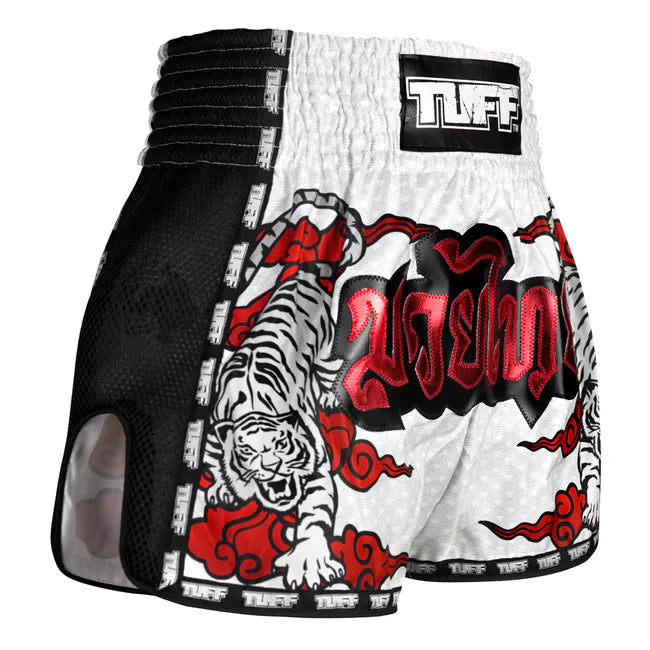 Black and white boxing shorts with red tiger design and 'TUFF' branding on a white background