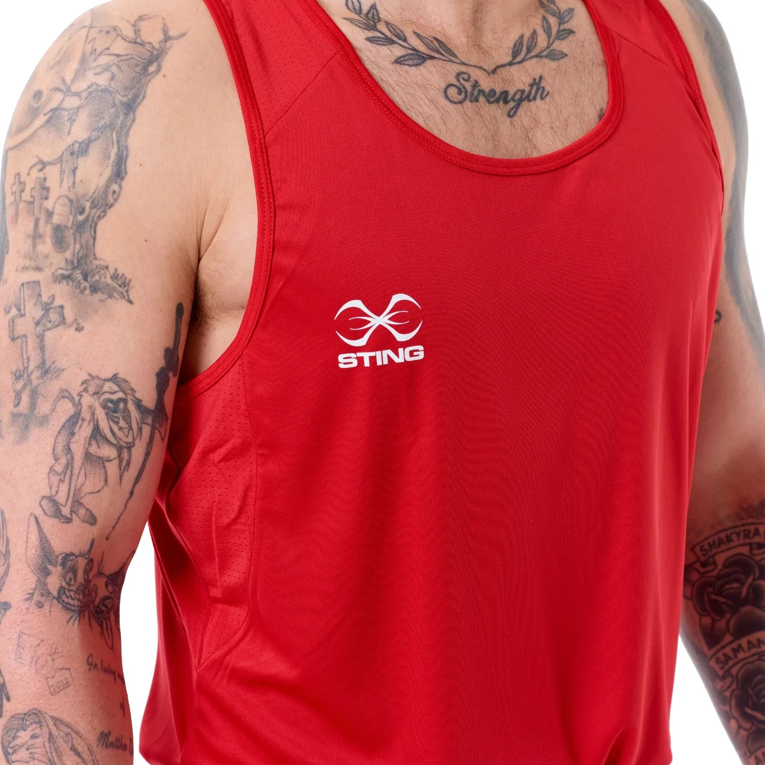Red boxing tank top with Sting logo on a male wearing it, showing tattoos on arms.