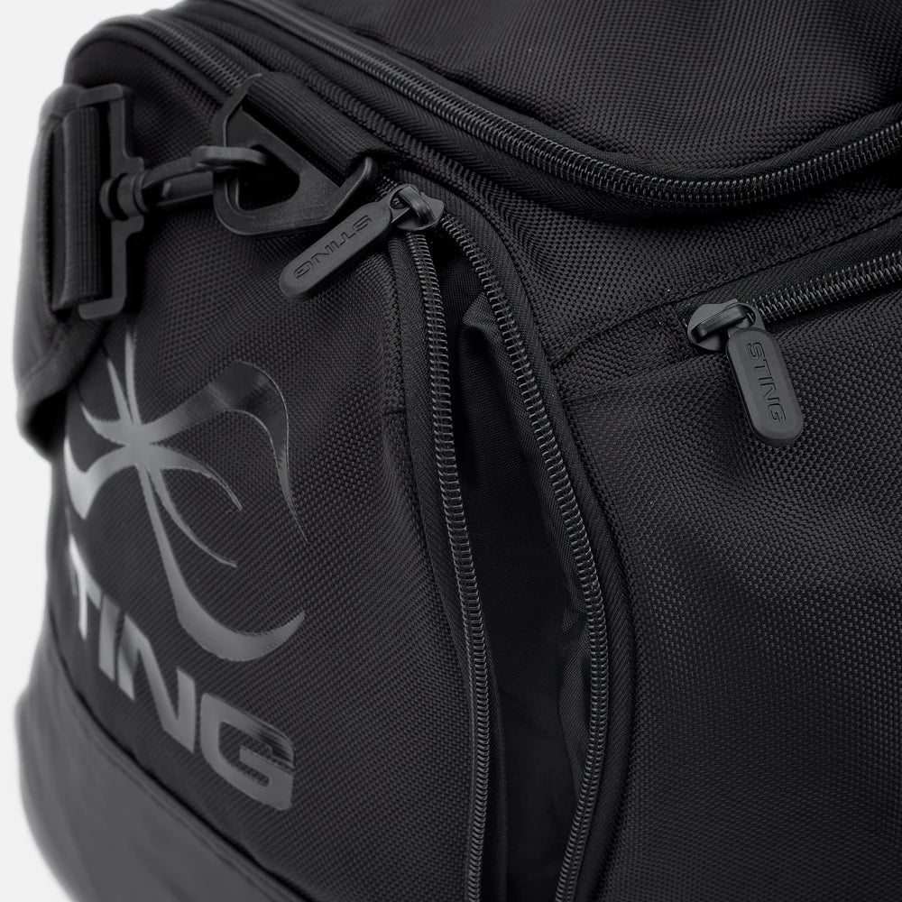 Black duffel bag with a prominent logo on a white background