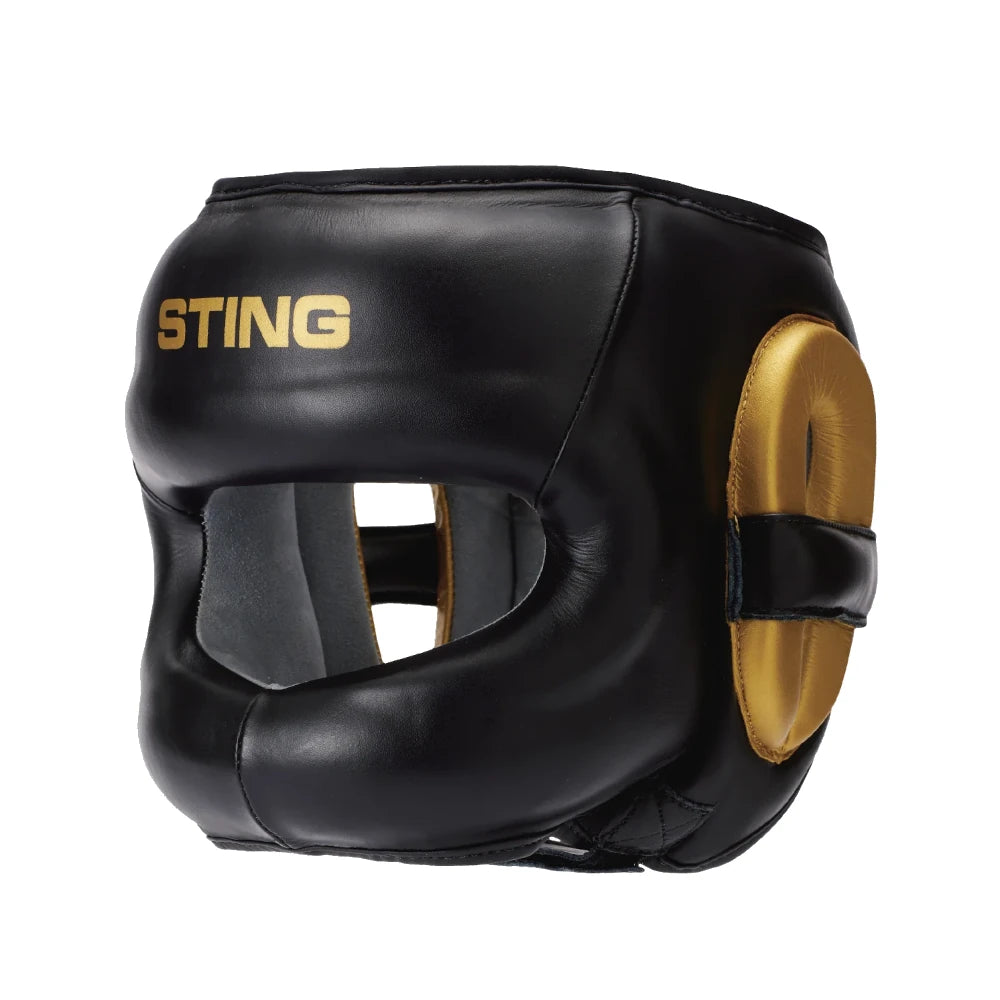 Black boxing headgear with gold accents and 'Sting' branding on a white background