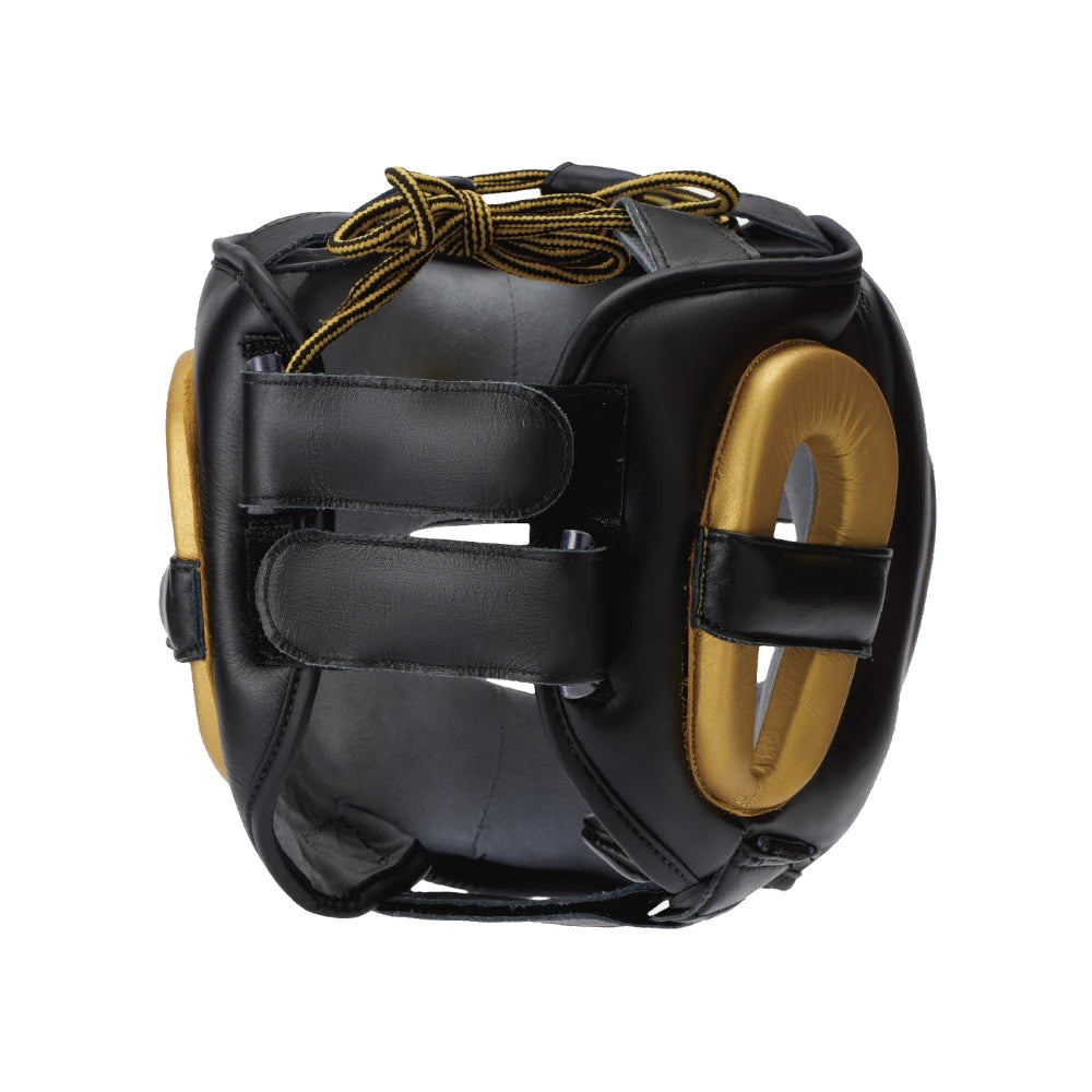 Black and gold boxing headgear with dual pull back straps on a white background