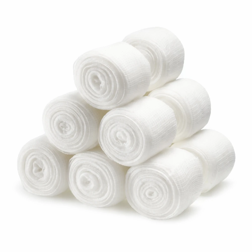 Stack of white rolled boxing gauze on a white background