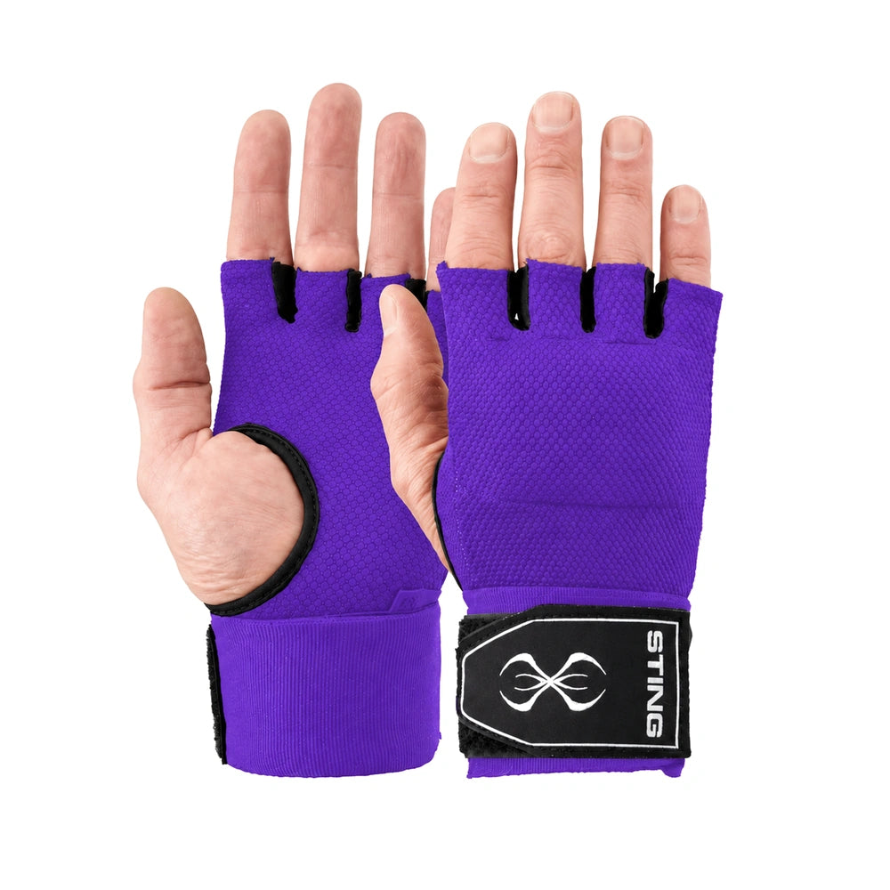 A pair of purple fingerless boxing quick wraps with black trim and a black wrist strap featuring a white logo, shown on hands against a plain white background.
