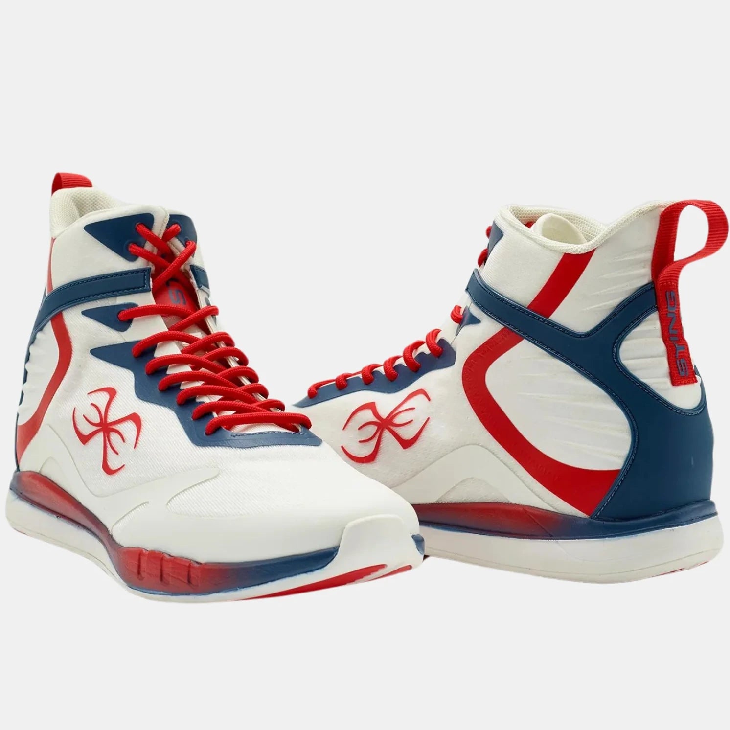 White high-top boxing sneakers with red and blue accents on a white background