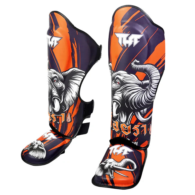 Pair of colourful martial arts shin guards with elephant design on a white background