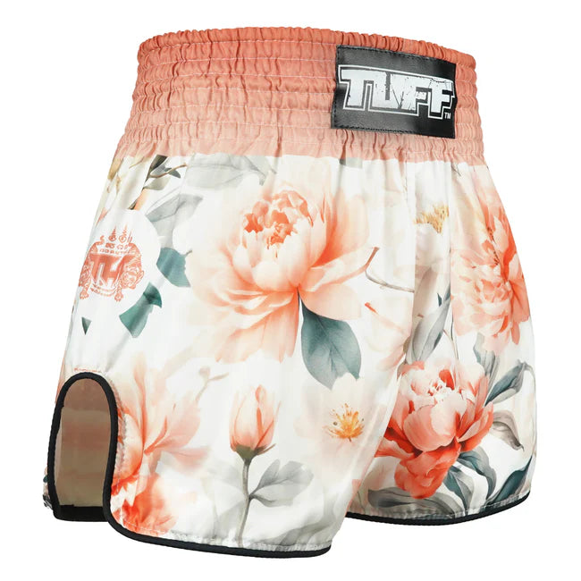 Floral patterned Thai shorts with a brand label on a white background