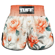Floral-patterned Thai boxing shorts with 'TUFF' branding on a white background