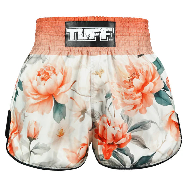 Floral-patterned Thai boxing shorts with 'TUFF' branding on a white background