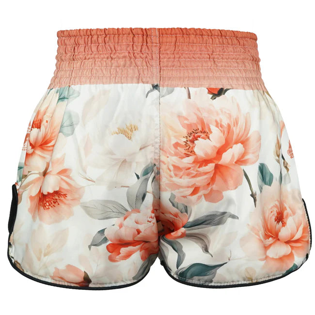 Floral Muay Thai shorts with a pink waistband on a white background