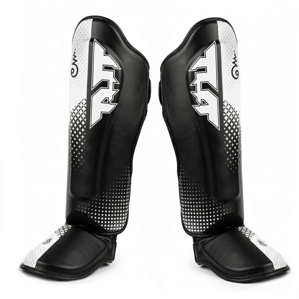 Black and white shin guards with a brand logo on a white background