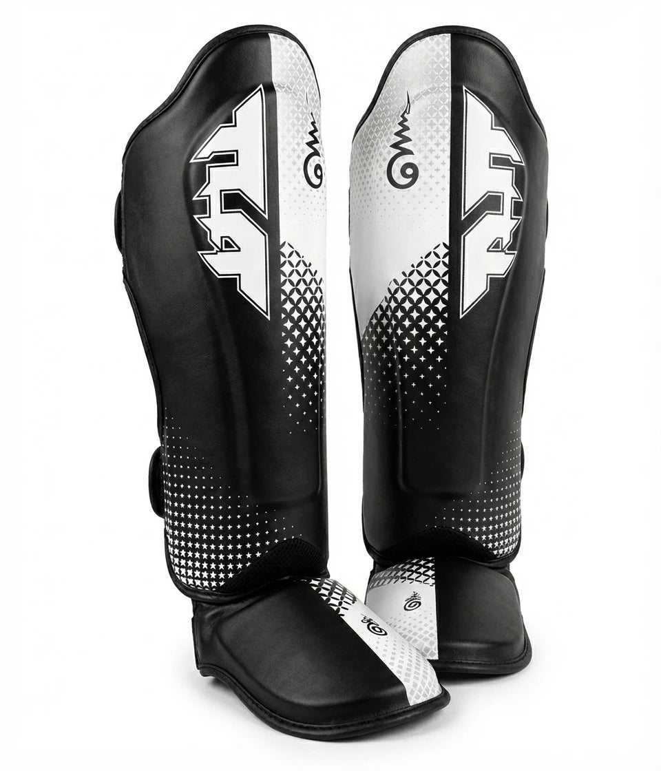 Black and white shin guards with brand logo on a white background