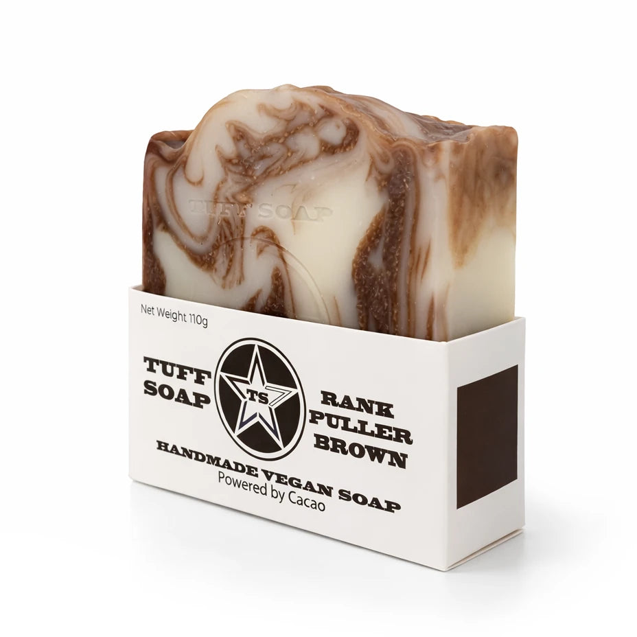 Marbled brown and white soap bar in a white box with branding on a white background