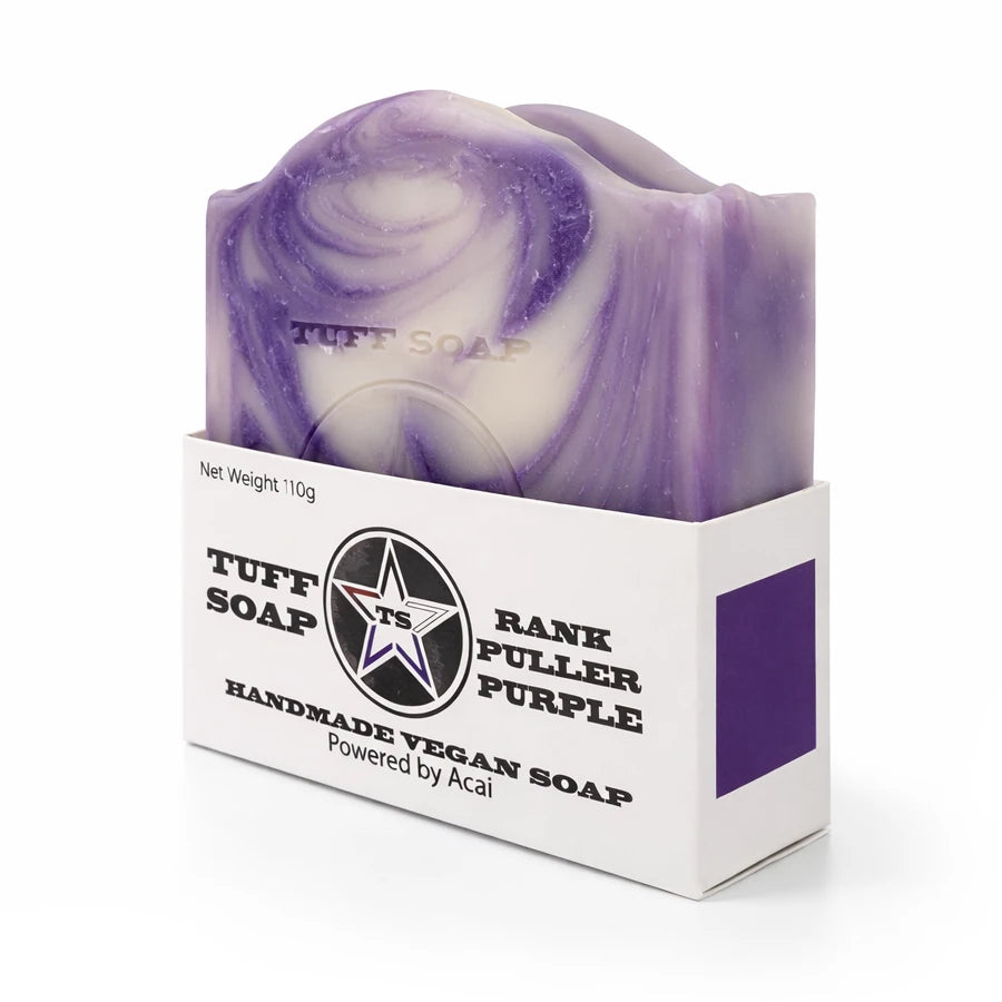 Purple and white swirled soap bar in Tuff Soap packaging on a white background