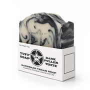 Black and white swirled soap bar with Tuff Soap packaging on a white background