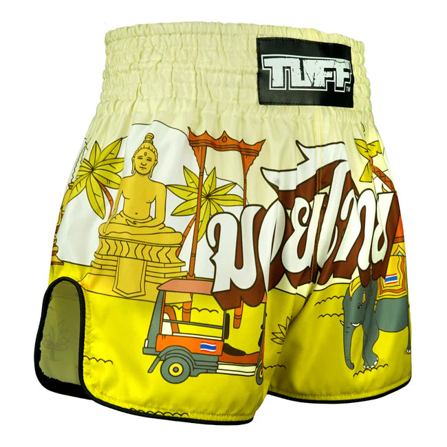 Colourful Thai boxing shorts with cultural graphics and 'TUFF' brand label on a white background