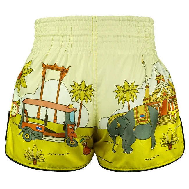 Yellow Muay Thai shorts with elephant and tuk-tuk design on a white background