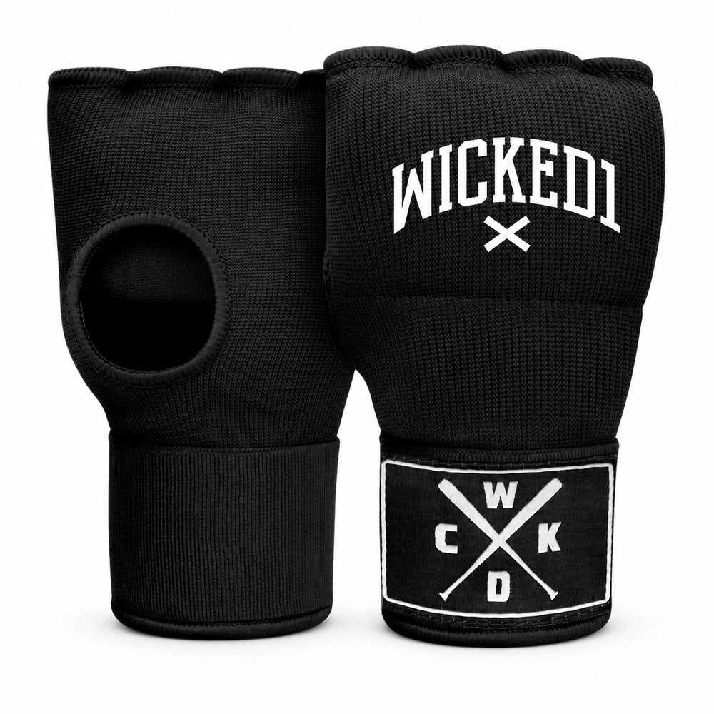 A pair of black fingerless quick wraps with white branding. One glove displays 'WICKED1' in an arched collegiate font above crossed white lines, while the other shows a rectangular patch with 'W', 'C', 'K', 'D' arranged around crossed white baseball bats.
