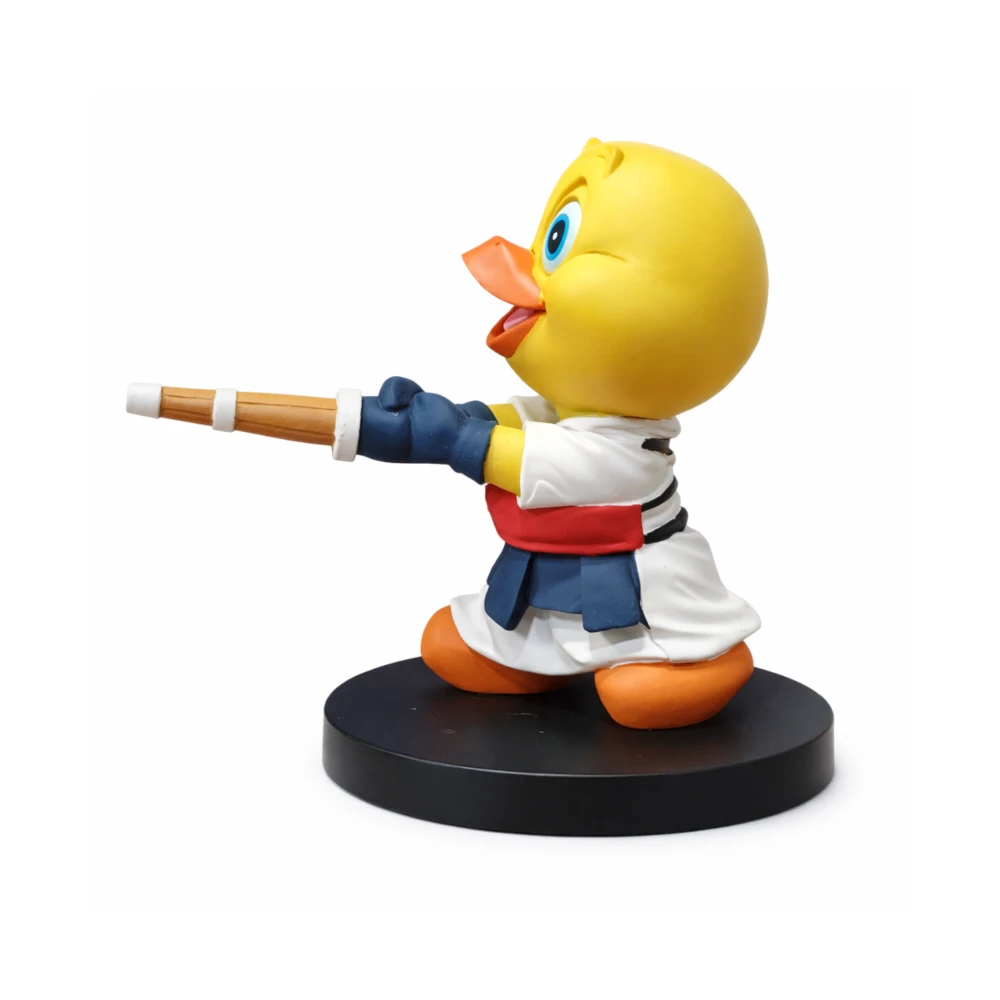 Animated character figurine holding a wooden sword on a white background