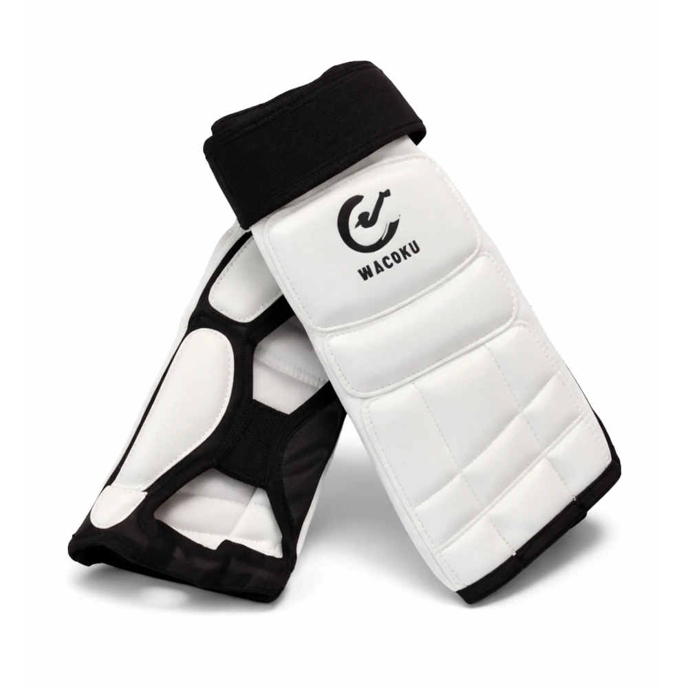 White feet protectors with black accents on a white background, featuring the Wacoku logo.
