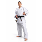 Male wearing a white martial arts uniform with a black belt on a white background