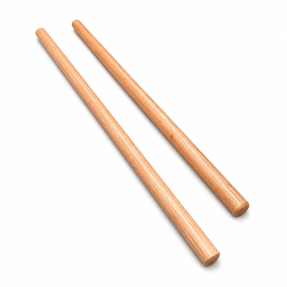 Wooden peeled Escrima sticks on a white background