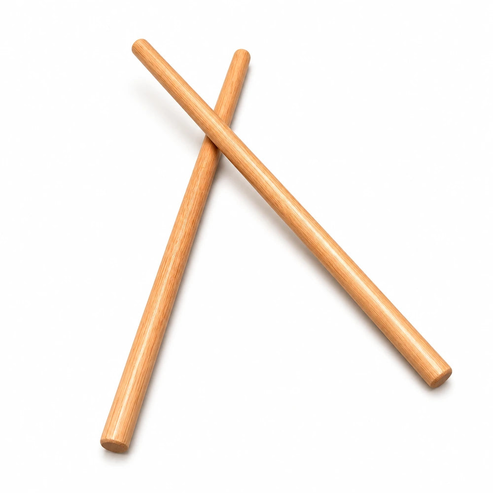 Wooden peeled Escrima sticks on a white background