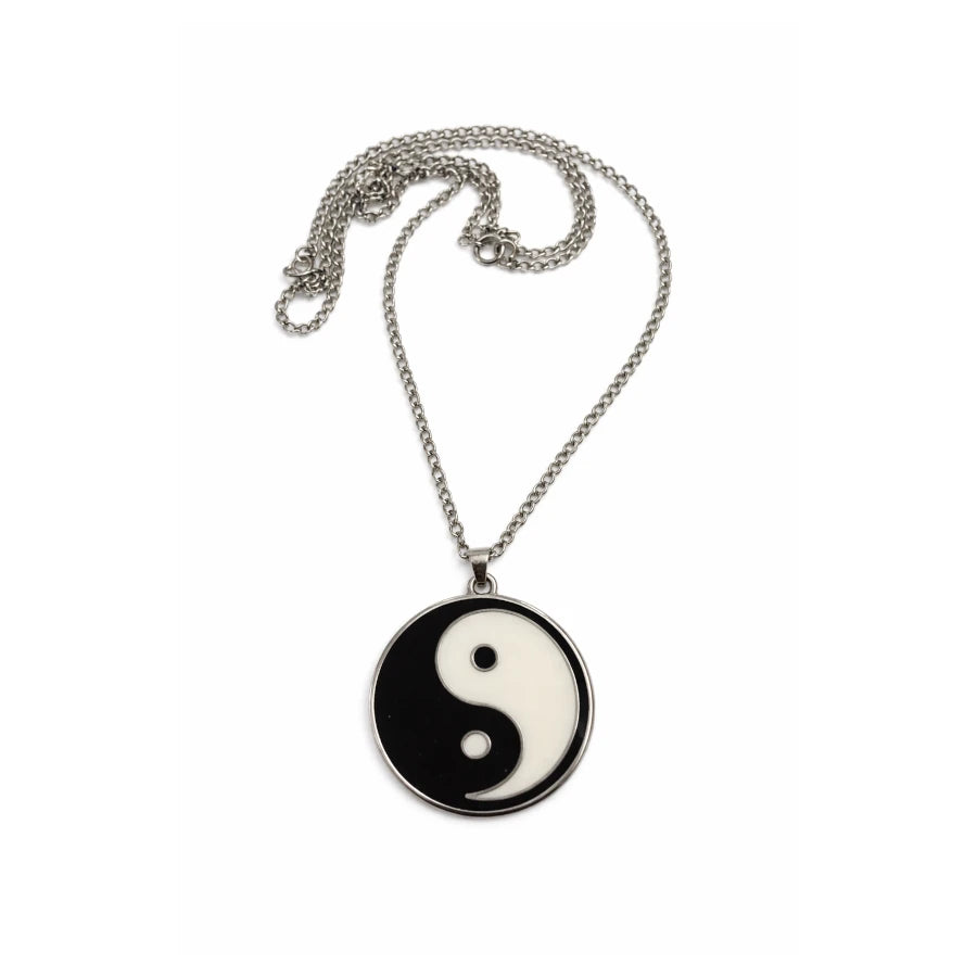 Yin yang pendant necklace on a white background