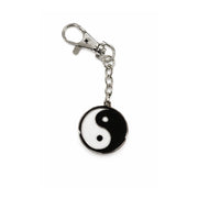 Yin yang symbol keychain on a white background